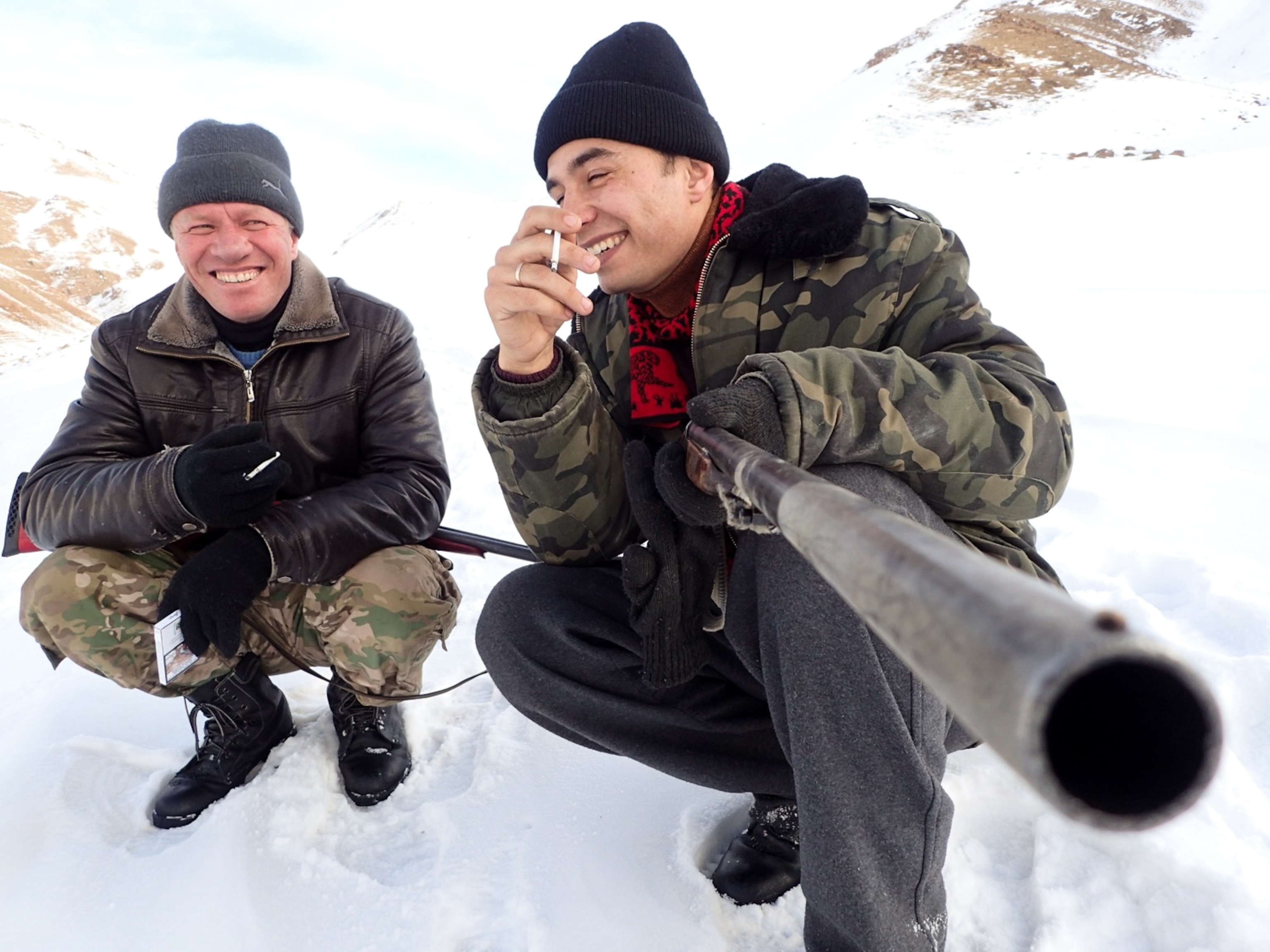 “Konstantin Inchin, ‘a taciturn maker of fine apple wine,’ and Salopek’s walking partner, Sergei Gnezdilov, take a break from hunting in the foothills of Kyrgyzstan.” From Salopek’s Dispatch, “Did We Hurtle Out of Africa on a Spear Tip?”