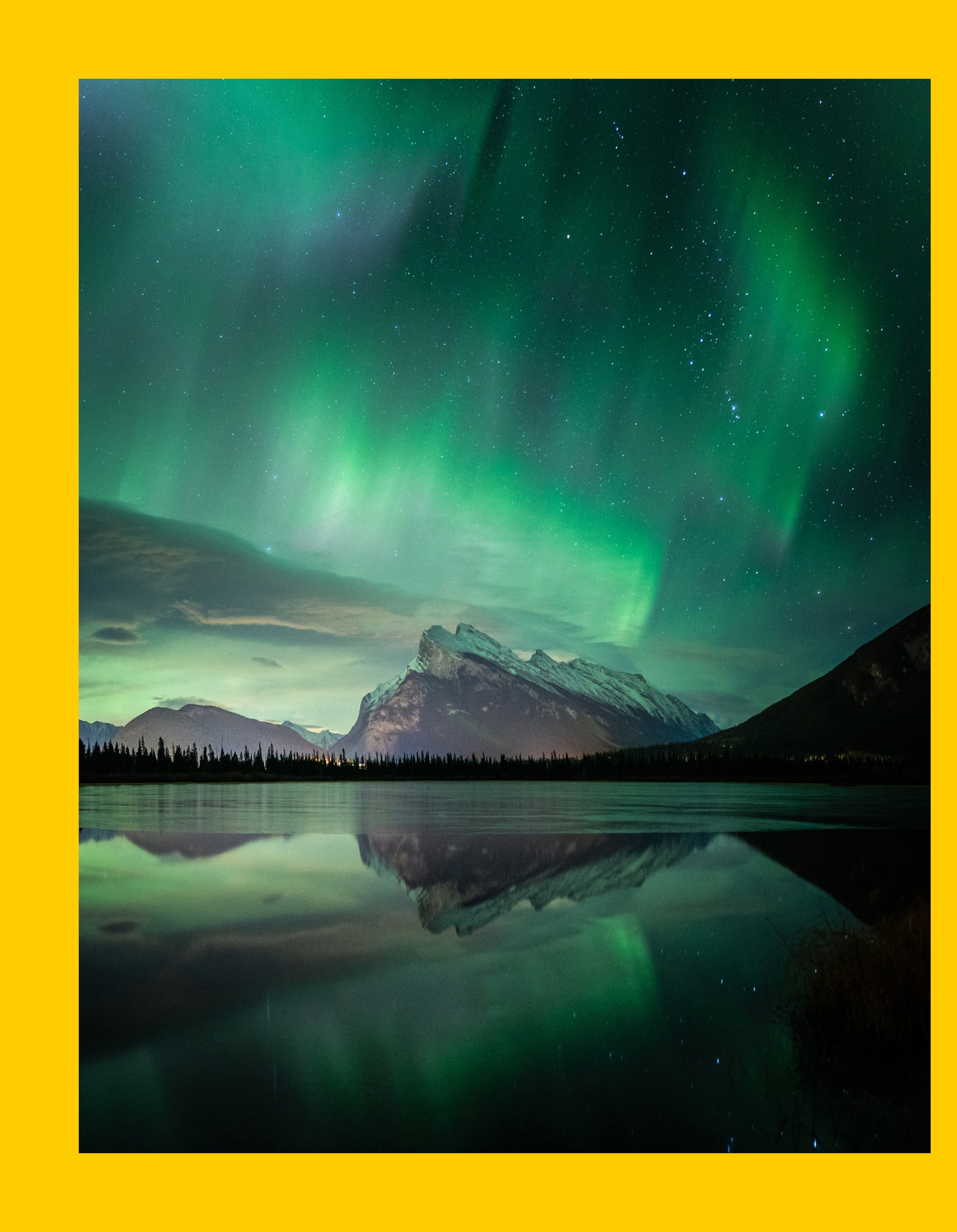 Banff National Park sits in a region where aurora shows can often fill the entire sky. Seen here is Mount Rundle at Vermilion Lakes one of the iconic landmarks of the Canadian Rockies.