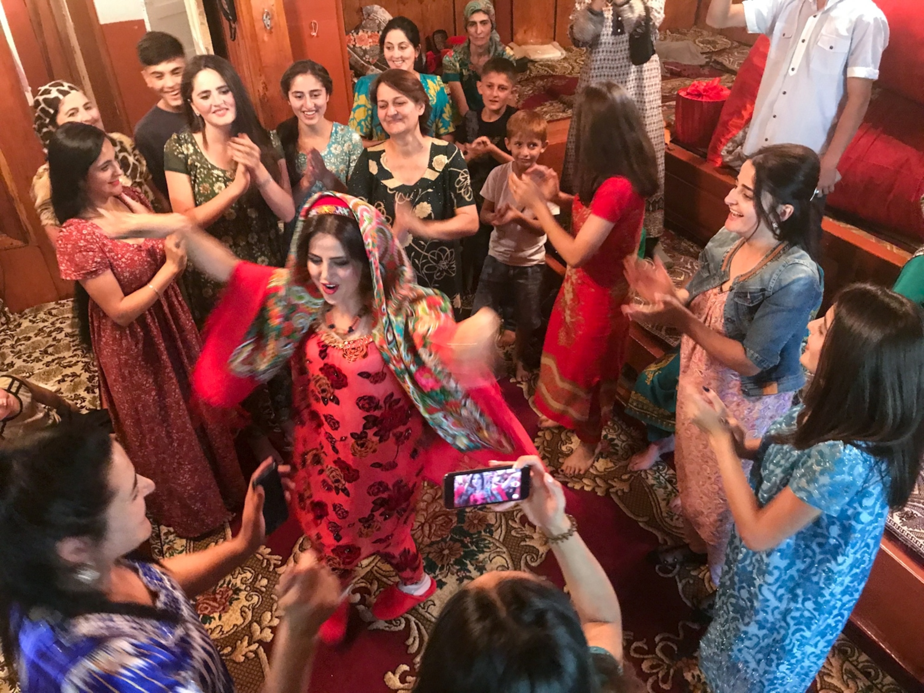 From “Islam in Hiking Sandals — and Red Spike Heels.” Mountain guide Safina Shoxaydarova dances with friends at her traditional Pamiri wedding in Khorog, Tajikistan, where Salopek arrived in 2017. “I am really feeling pleased to join you for the trip we made,” Shoxaydarova later told Salopek. “It was really making me feel more strong and confident.”