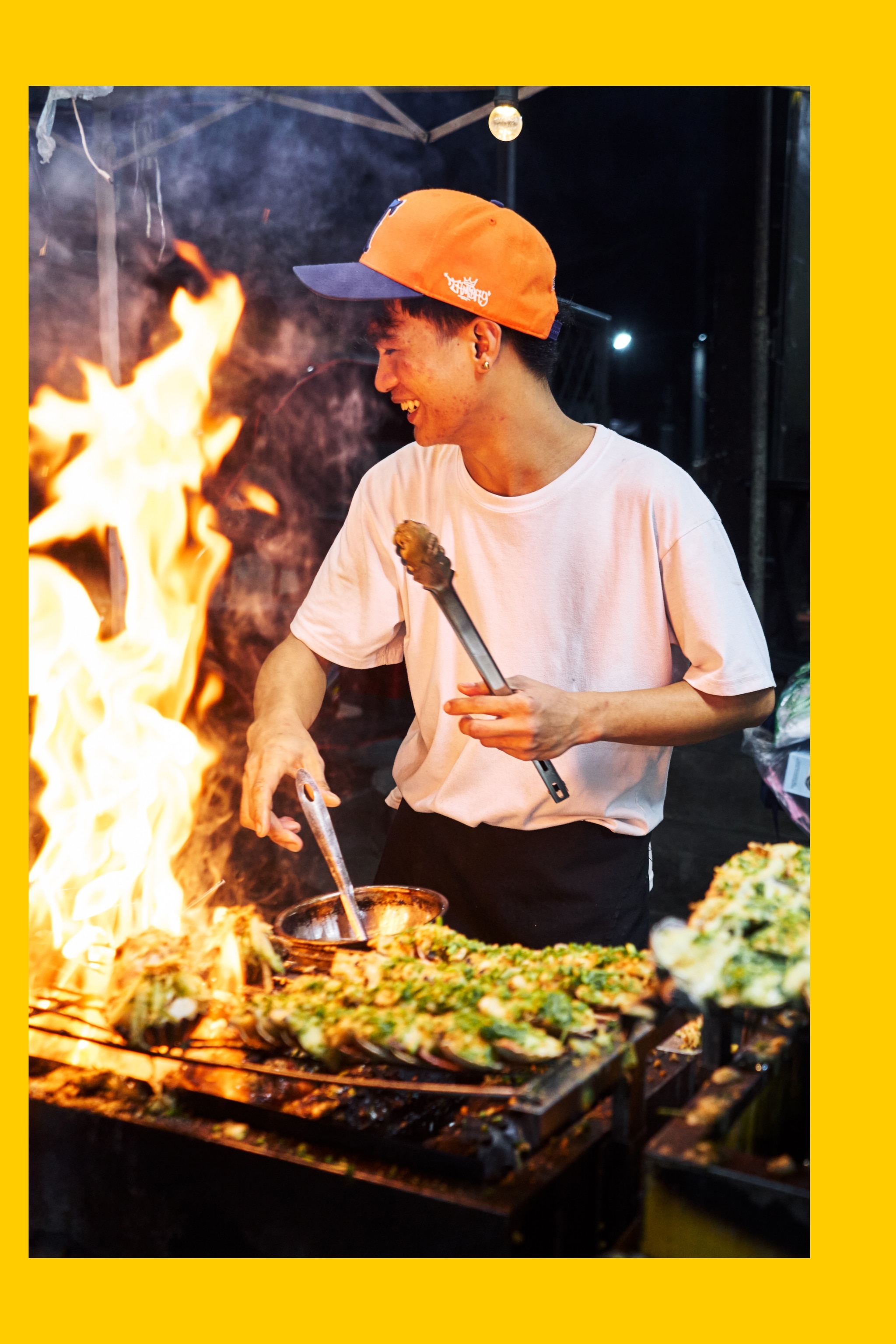 Jessi P. Zaruto, a chef at the King of Street Foods, cooks scallops on a grill at the Ugbo Street Food Shops and Takeaways in Metro Manila, Philippines.