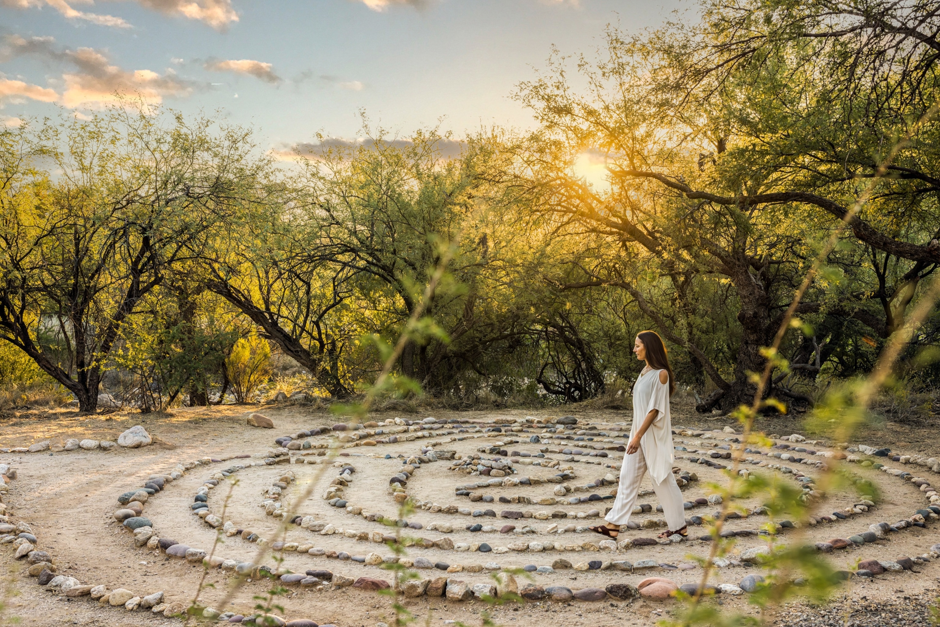 A woman walking the meditation labyrinth at canyon ranch Tucson.